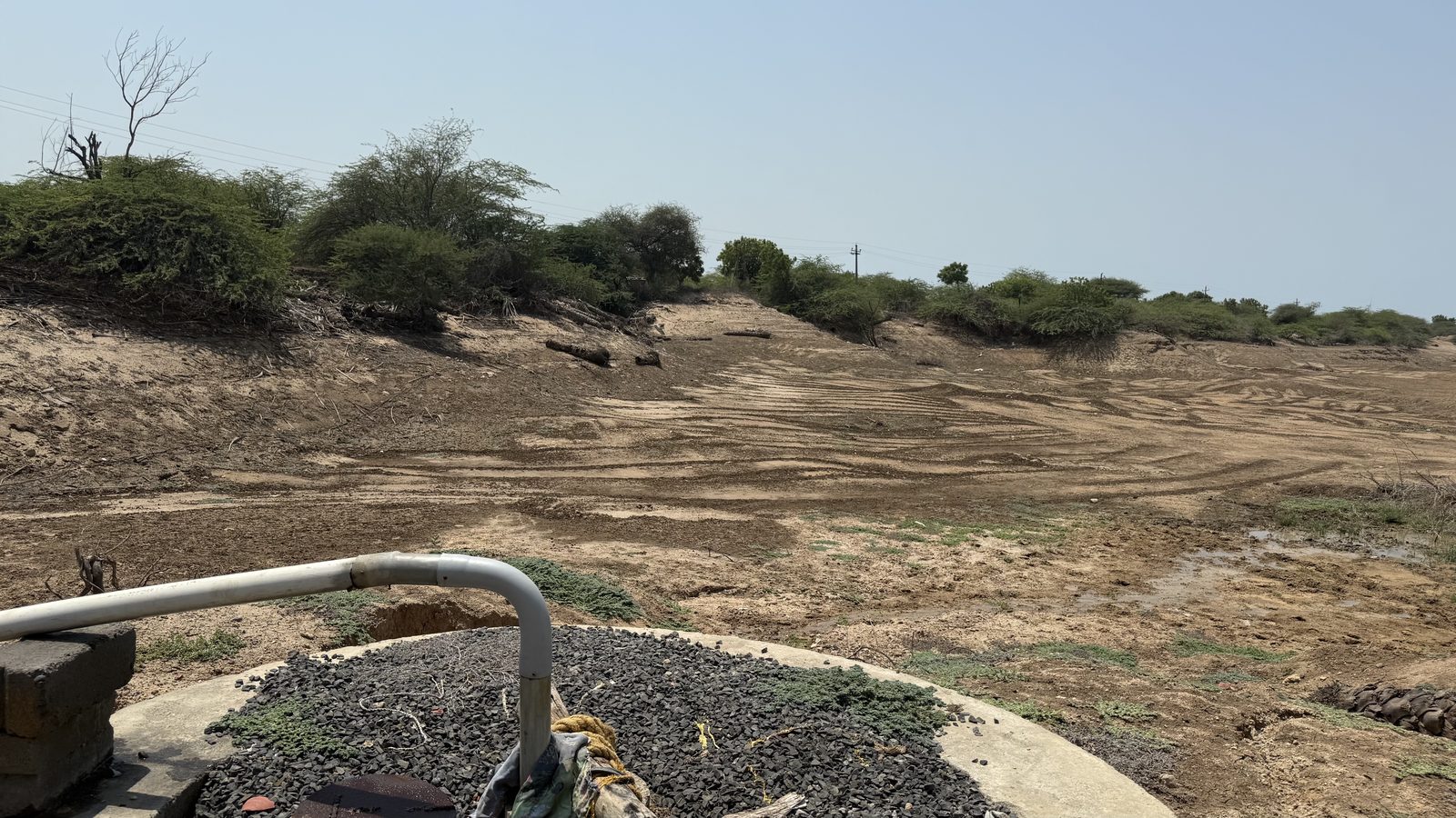 A lined recharge well beside the dry channel of the Nagmati river